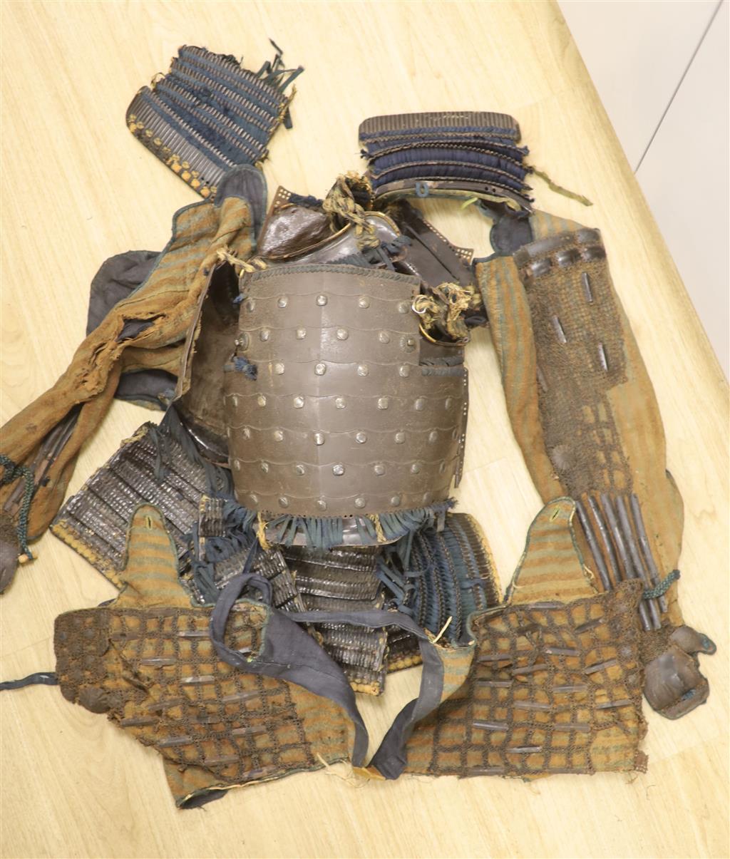 A Japanese iron armour Okegawa-do (Yoko-Hagi-horizontal make) 17th or 18th century, iron laminated breast and back plates with